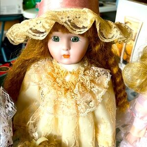 Elegant Lace Porcelain Doll with Golden Accents